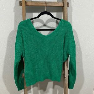 Green sweater crossover back